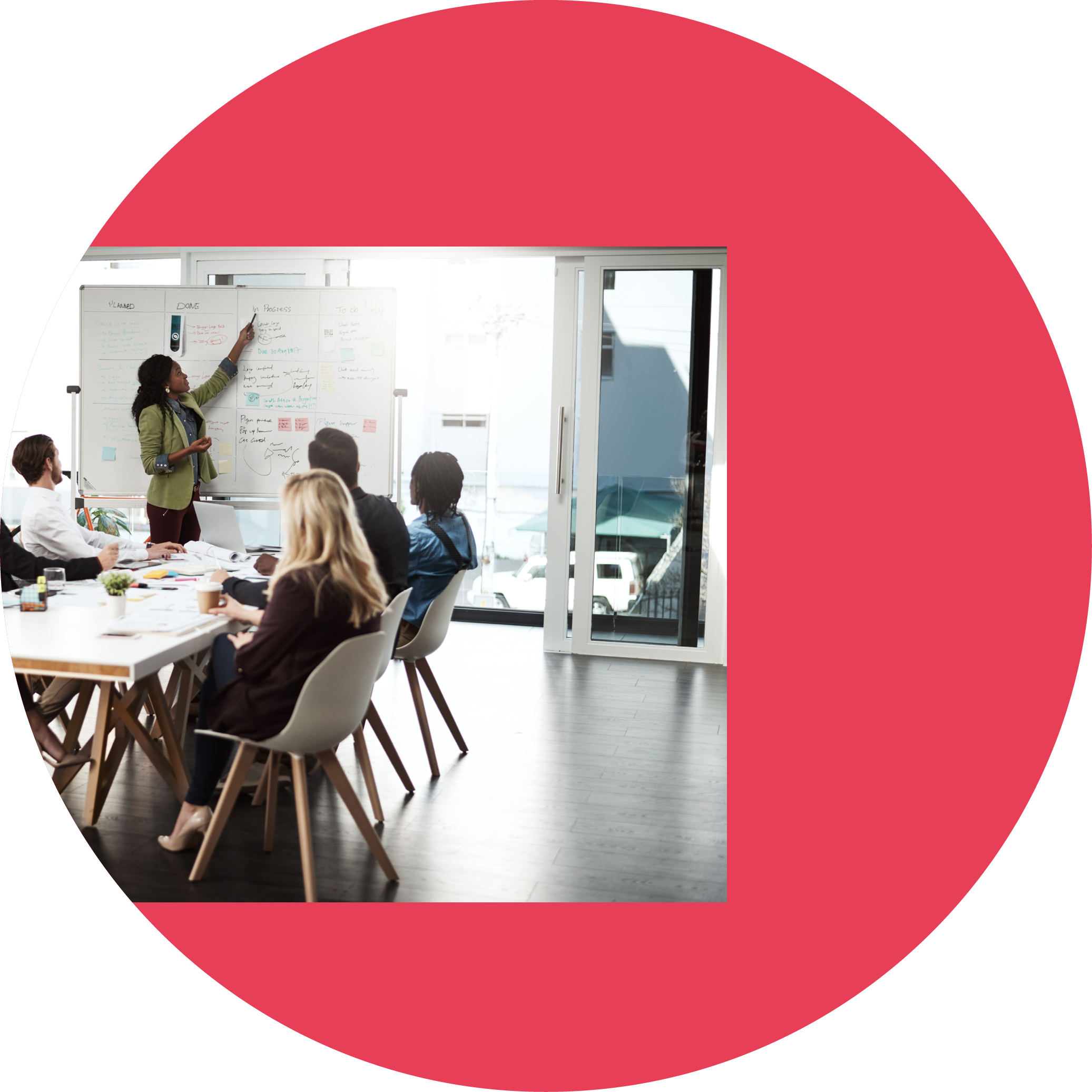 Shot of a businesswoman giving a presentation to her colleagues on a whiteboard in a boardroom