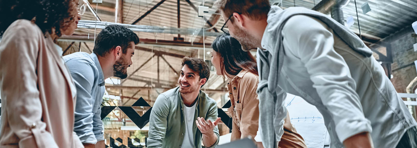 Group of young multiracial business people are working in modern office  Freelancers in coworking place  Creative and stylish youth 