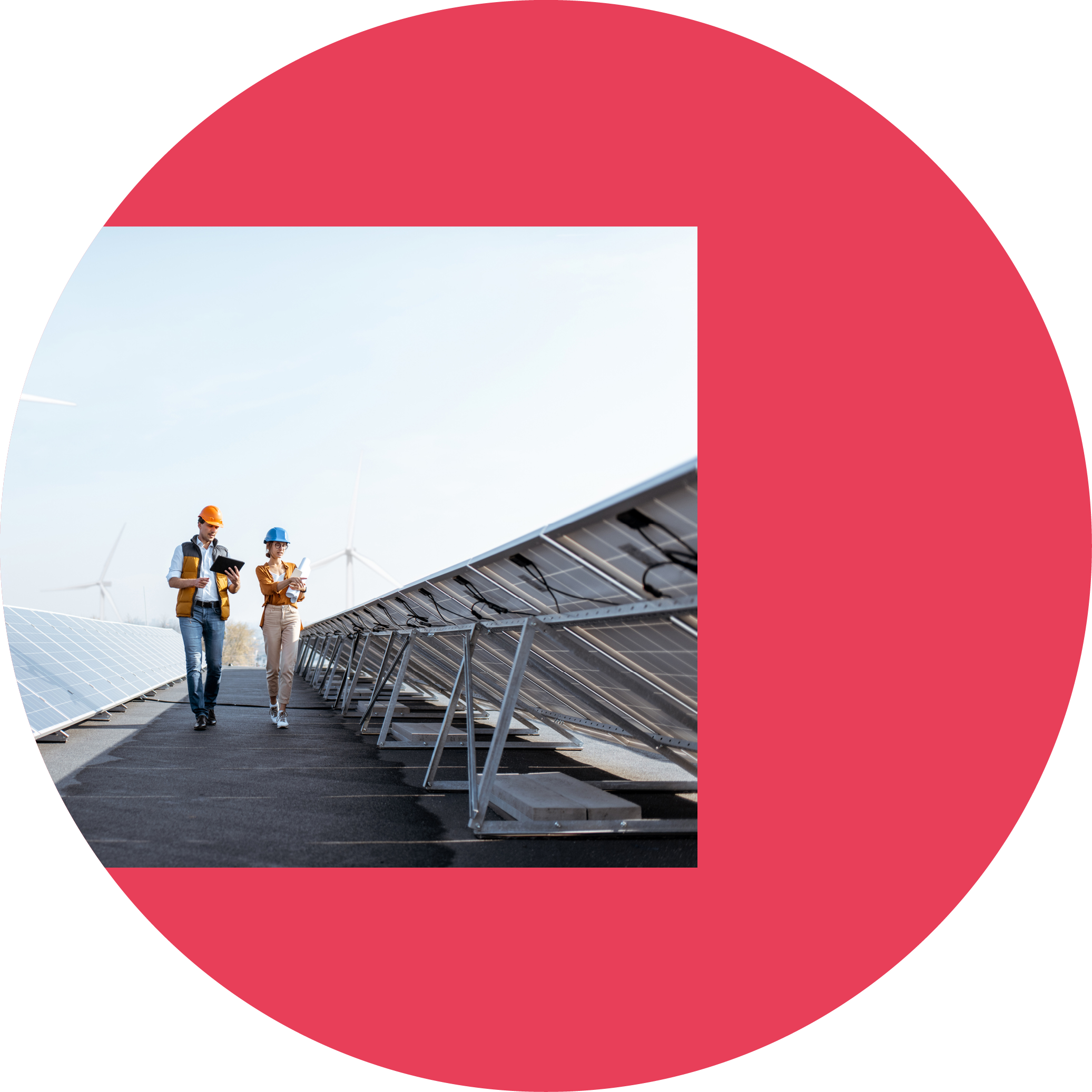 View on the rooftop solar power plant with two engineers walking and examining photovoltaic panels  Concept of alternative energy and its service
