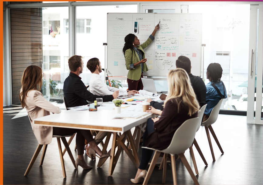 Shot of a businesswoman giving a presentation to her colleagues on a whiteboard in a boardroom